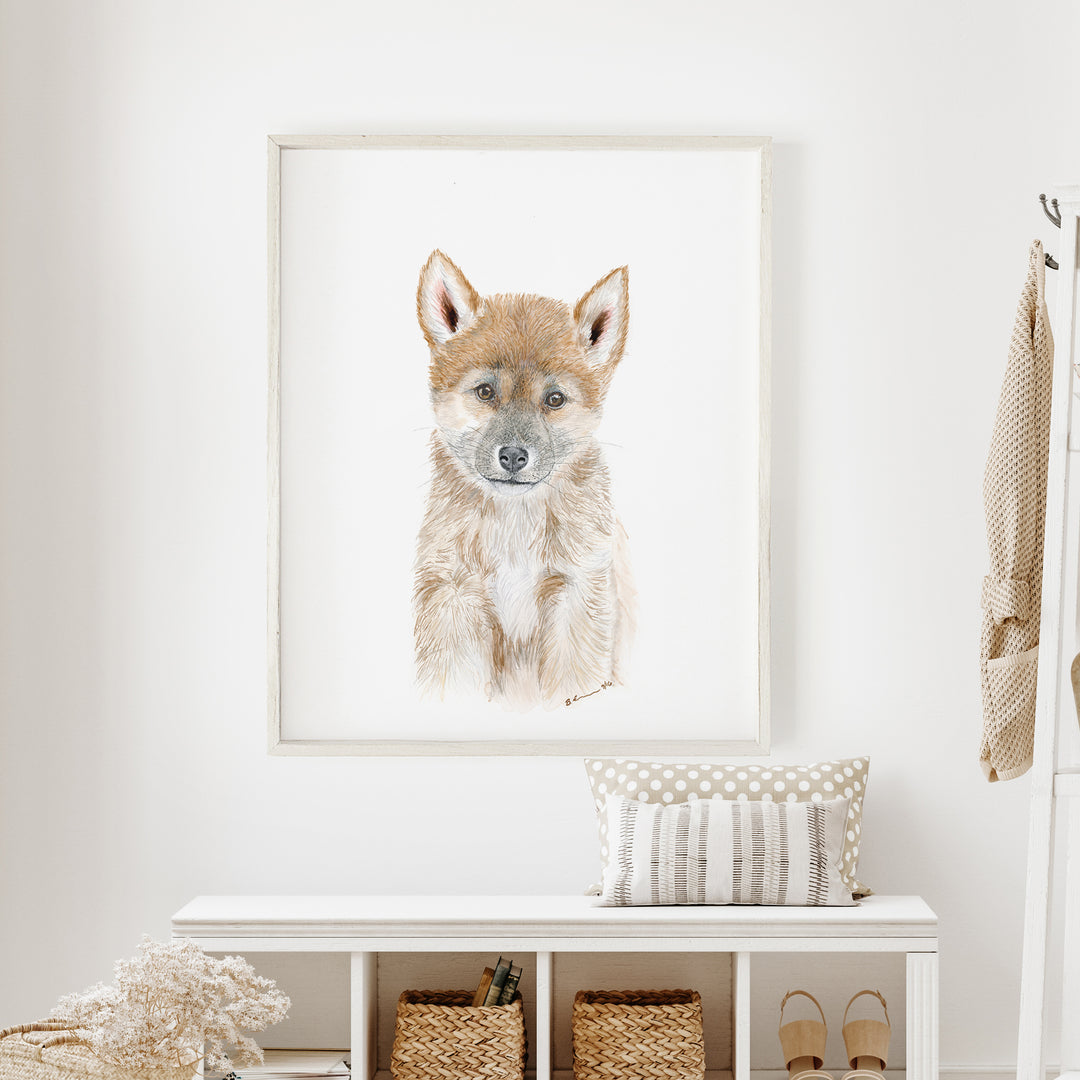 a picture of a dog is hanging on the wall