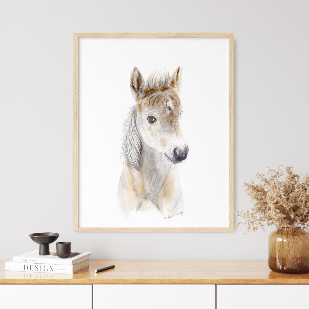 a picture of a dog on a wall above a table