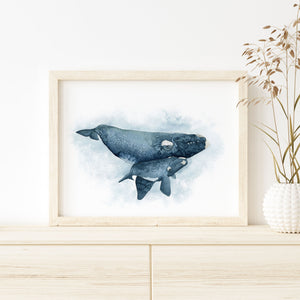 a picture of a whale in a frame on a dresser