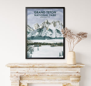a picture of grand teton national park hanging on a wall