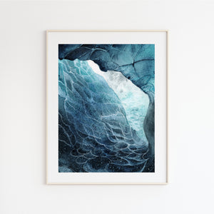 a picture of a blue ice cave in a white frame