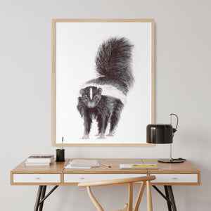 a picture of a squirrel on a wall above a desk