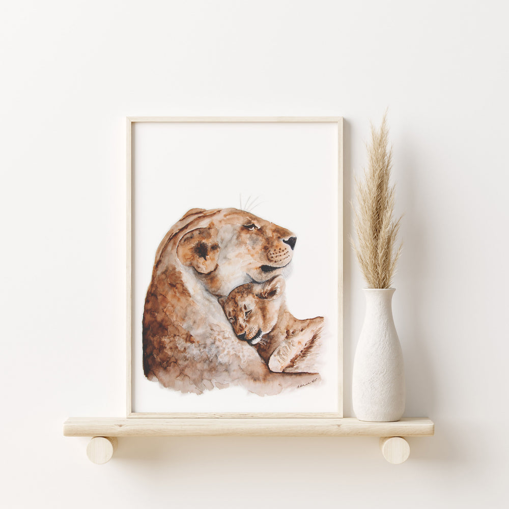 a picture of a lion and cub on a shelf