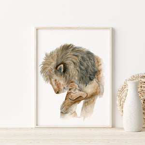 a picture of dad lion and his cub is on a shelf next to a vase