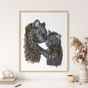 a picture of a couple of leopards in a frame