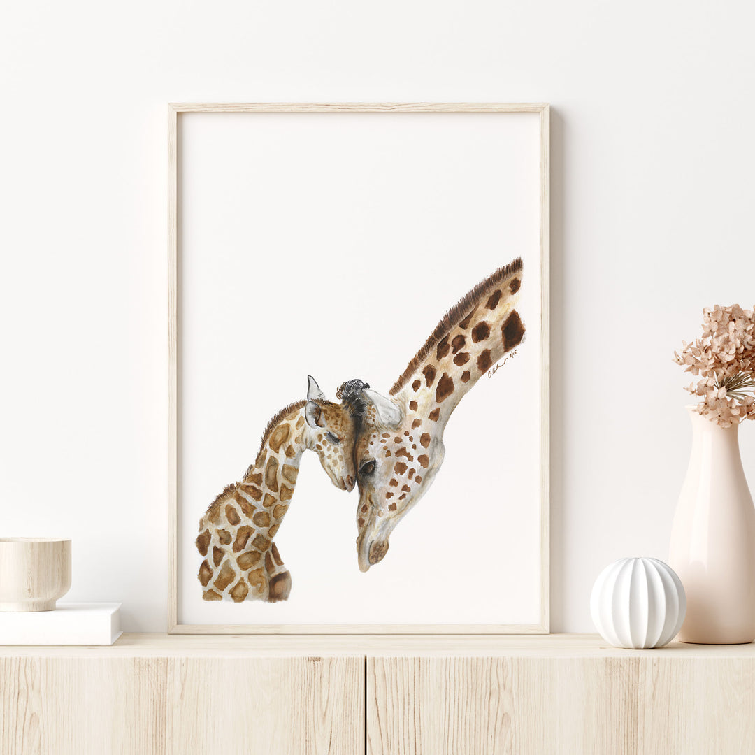 mom and baby giraffe watercolor print on shelf in safari nursery